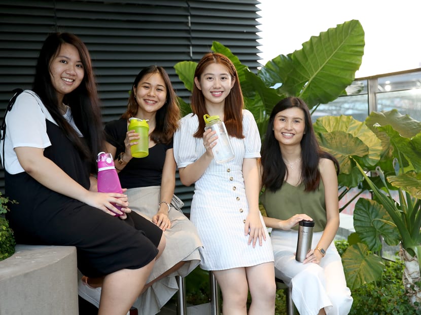 The Drink Wise, Drink Tap campaign encourages the consumption of tap water instead of bottled water. The students behind it are (from left) Ms Erny Kartolo, 22, Ms Goh Pei Xuan, 23, Ms Elaine Wong, 22, and Ms Tan Yen Ping, 23.
