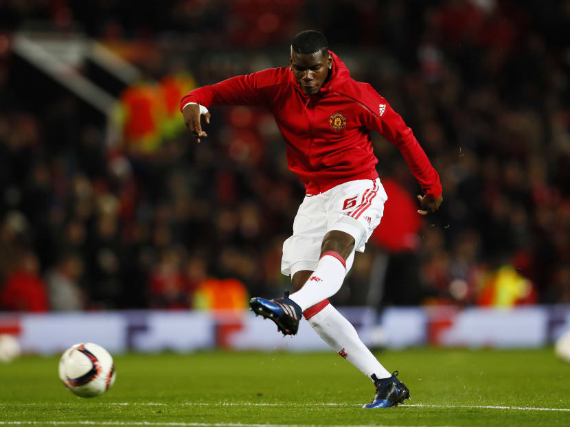 Manchester United's Paul Pogba warms up before the match. Photo: Reuters