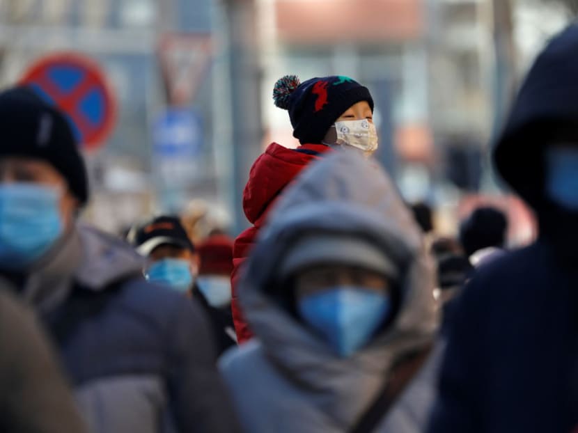 People wearing masks are seen in Beijing, China on Dec 8, 2020.