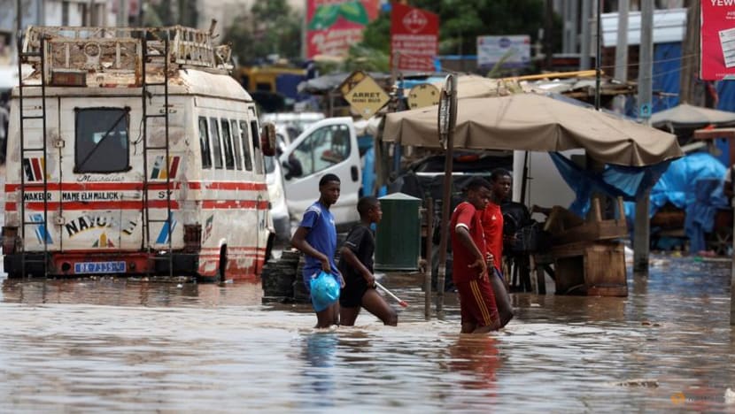 Senegal capital wades through floodwater after heavy rain Senegal capital wades through floodwater after heavy rain