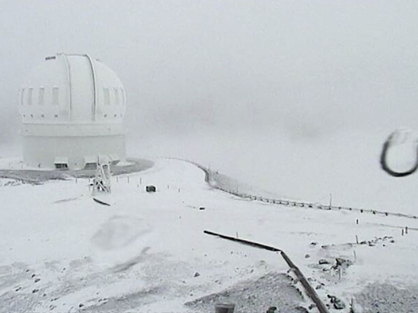 Tthe CFHT telescope on the summit of Mauna Kea on Hawaii’s Big Island is covered in snow on Thursday, Dec 1, 2016. Photo: Canada-France-Hawaii Telescope via AP