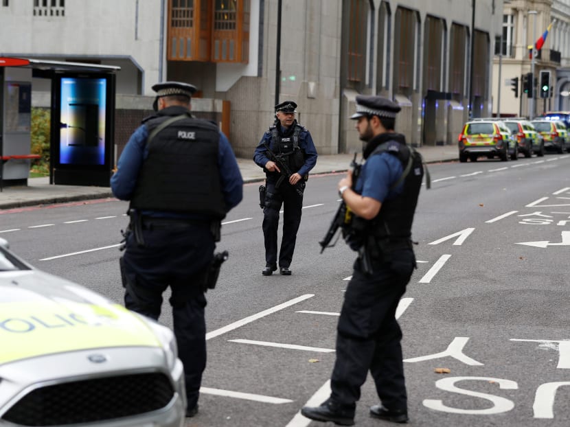 Police officers stand in the road near the Natural History Museum, after a car mounted the pavement injuring a number of pedestrians, police said, in London. Photo: Reuters