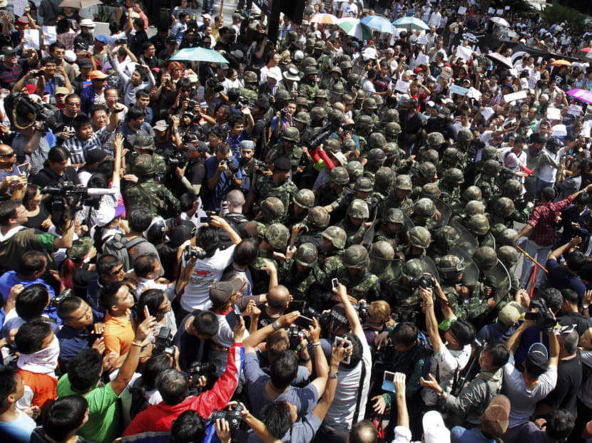 Hundreds defy Thai junta warning against protests