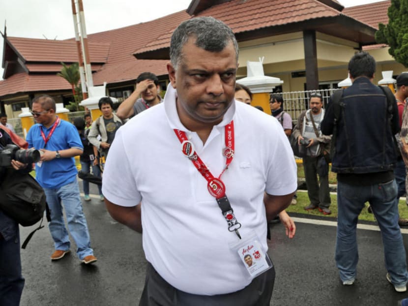 In this Wednesday, Dec. 31, 2014 file photo, AirAsia Group CEO Tony Fernandes walks upon arrival to visit the command center of the search operation for the victims of AirAsia Flight 8501 at the airport in Pangkalan Bun. Photo: AP