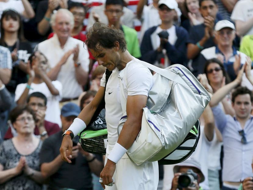 Rafael Nadal walking off court after losing his match against world No 102 Dustin Brown at the Wimbledon Tennis Championships in July 2015. That was the last time he played a competitive match on grass. Photo: Reuters