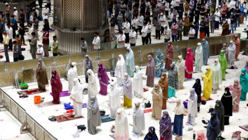 Indonesia Muslims begin Ramadan with social distanced prayers, COVID-19 vaccines