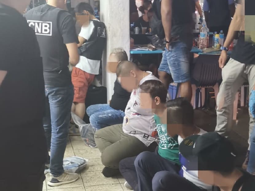Suspected drug offenders being arrested in the vicinity of Geylang Lorong 10 on July 16, 2019.