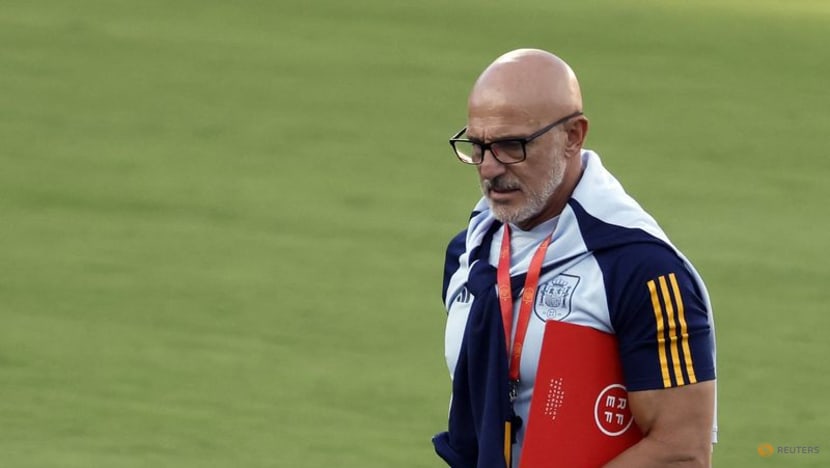 Spain's men's coach sticks to football amid kiss furore
