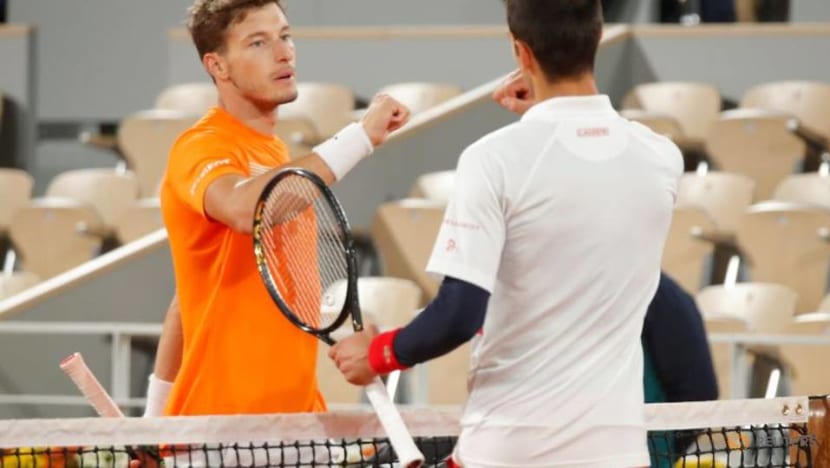 Djokovic survives scare to beat Carreno Busta Djokovic survives scare to beat Carreno Busta