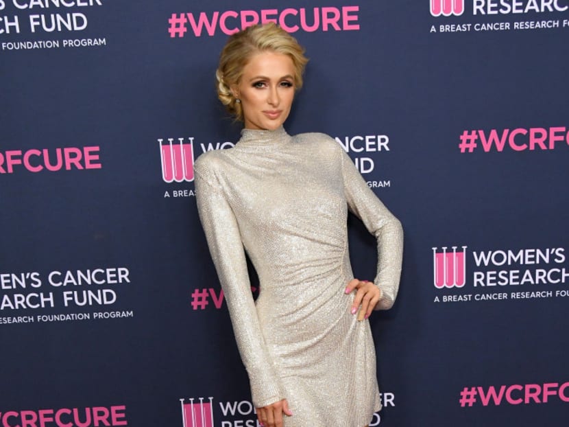 Paris Hilton has denied reports she’s expecting her first baby with fiance Carter Reum.
