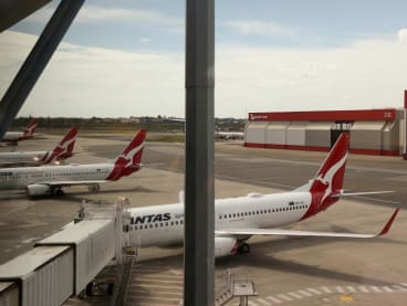 Qantas planes are seen at a domestic terminal at Sydney Airport in Sydney, Australia on Nov 16, 2020. 