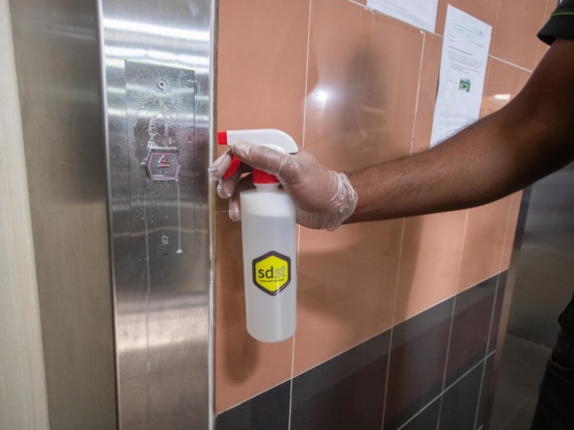The disinfecting coating agent called SDST being applied to lift buttons at public housing blocks. The disinfecting coating agent called SDST being applied to lift buttons at public housing blocks.