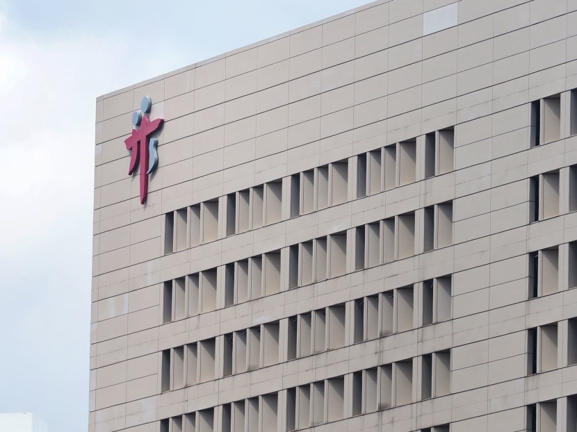 The logo of Tan Tock Seng Hospital at the top of its building. The latest person who died of complications from Covid-19 was a patient in Ward 9D there.