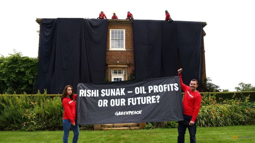 Environmental activists arrested after covering UK PM's home in black