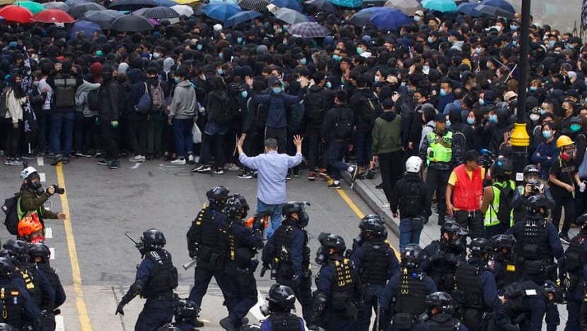 Police arrest organiser of Hong Kong protest after rally turns violent Police arrest organiser of Hong Kong protest after rally turns violent
