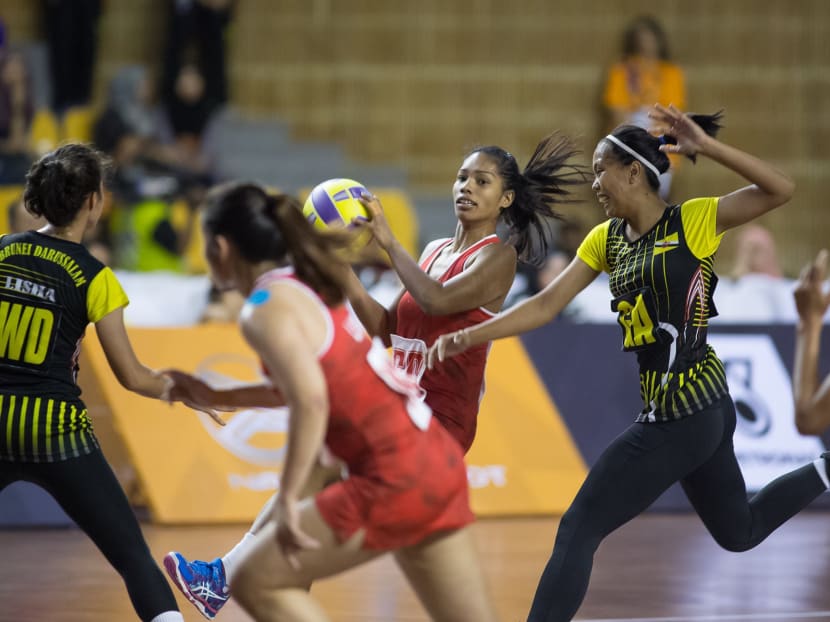 Team Singapore's netballers (in red) defeated Brunei 62-37 in their SEA Games opening match at Juara Stadium on Monday (Aug 14). Photo courtesy of Leo Shengwei/Playmaker