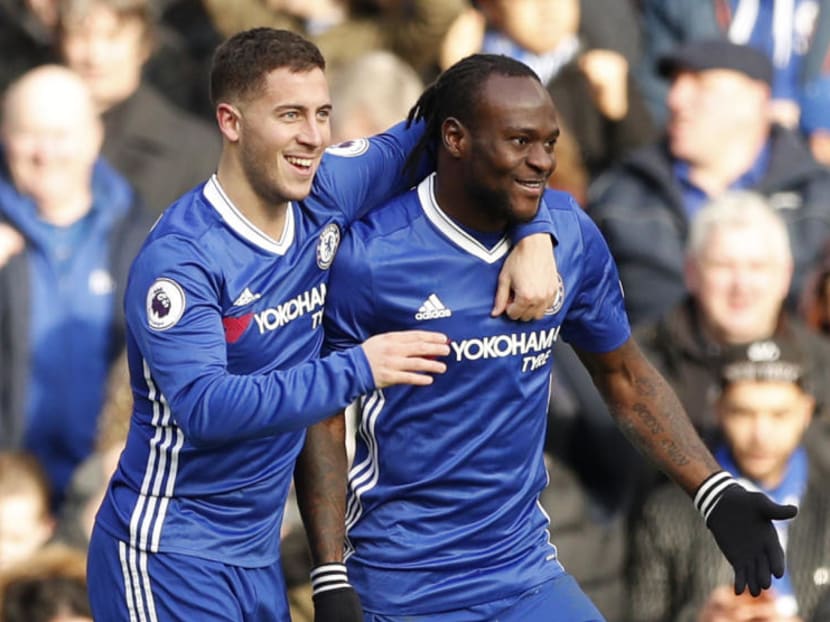 Chelsea's Eden Hazard celebrateing his goal with teammate Victor Moses. Photo: Reuters