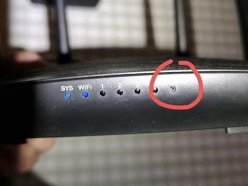 The woman examined the man’s router and realised it had been altered. The woman examined the man’s router and realised it had been altered.