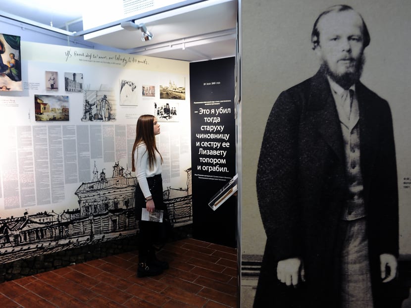 A picture taken on Jan 21, 2016 shows a woman visiting an exhibition commemorating the 150th anniversary of the publication of Russian writer Fyodor Dostoyevsky's Crime and Punishment at the author's museum in Saint Petersburg. Photo: AFP