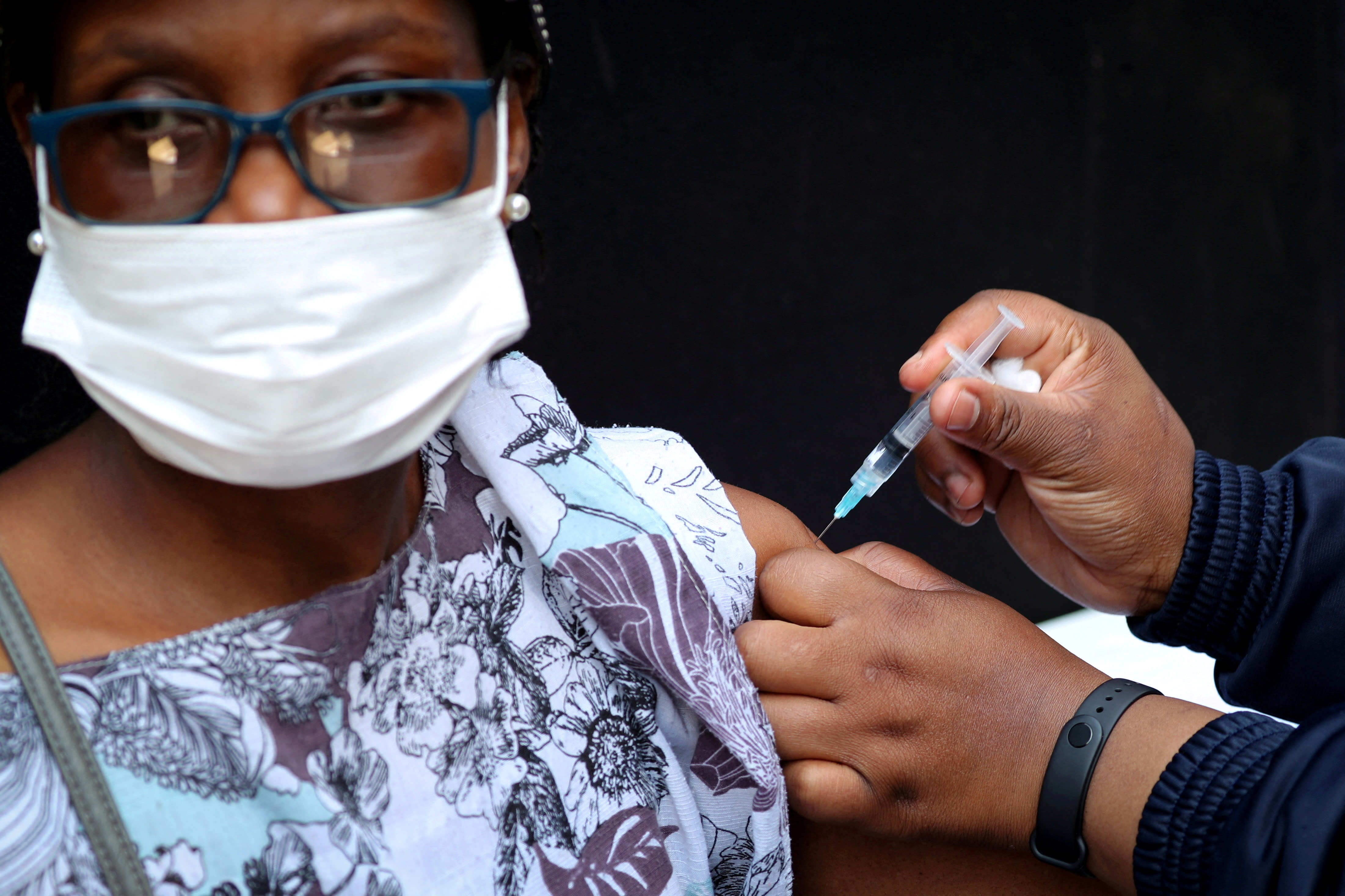 A healthcare worker administers the Johnson and Johnson Covid-19 vaccination to a woman in Houghton, Johannesburg, South Africa on Aug 20, 2021. 
