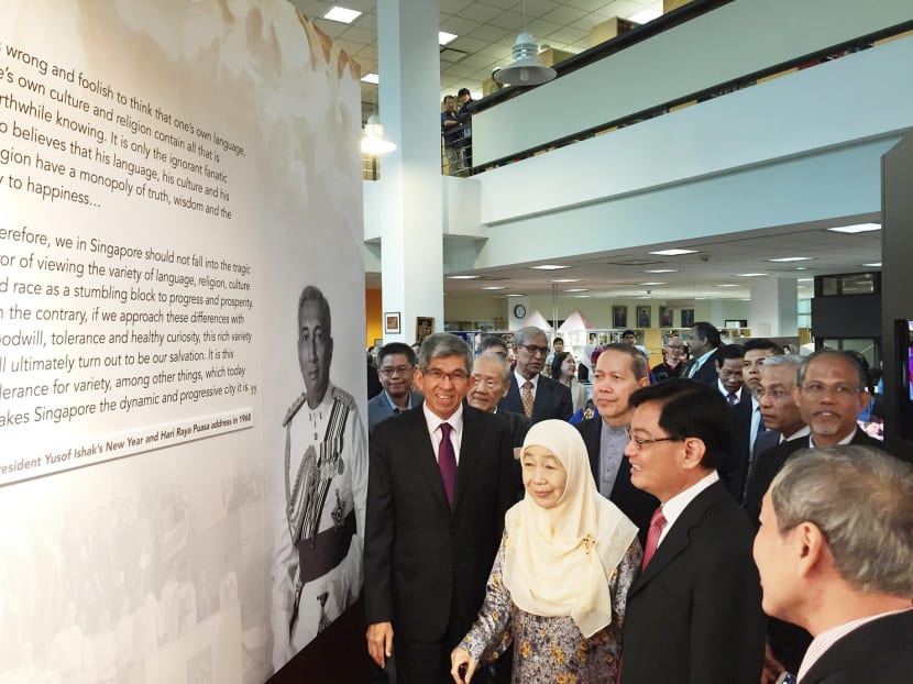 Guests, including ministers and Puan Noor Aishah, touring the exhibition on the life and contributions of Singapore’s first President Yusof Ishak. Photo: Valerie Koh