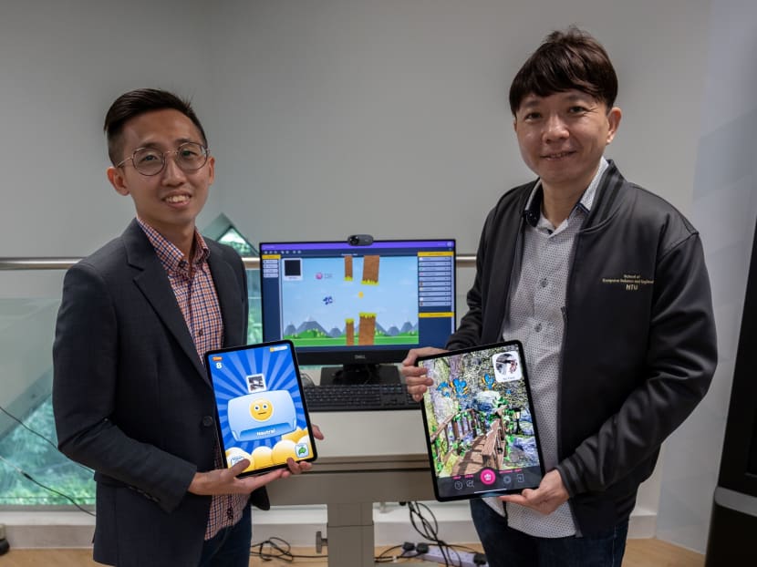 Project Officer Mr Ivan Yew (left) and Professor Ong Yew Soon (right) of NTU’s Data Science and Artificial Intelligence Research Centre, where mobile apps were developed for students with special needs.