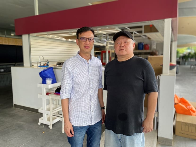 The author Aaron Yeoh (left) with Mr Alex Seow, who has a visual impairment, at their new café at Singapore Management University.