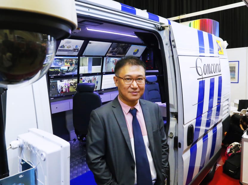 Concorde Security executive director Alan Chua with the I-Man Facility Sprinter. The vehicle was among the exhibits featured at the Architecture & Building Services 2015 Series that ended today at Marina Bay Sands. Photo: Ernest Chua