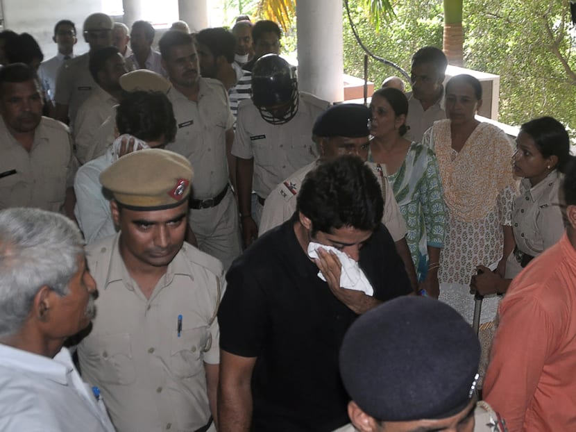 Police escort two men accused of gang raping a woman on their visit to a court in Rohtak. Photo: AFP