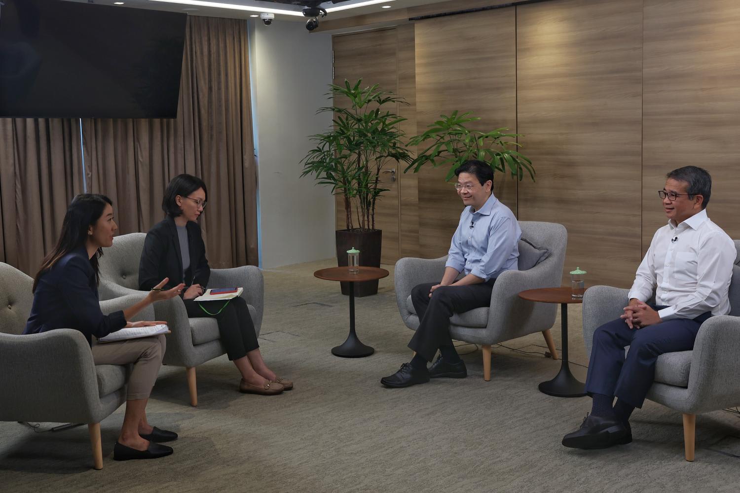 DPM Lawrence Wong (second from right) and Mr Edwin Tong at the interview with CNA. DPM Lawrence Wong (second from right) and Mr Edwin Tong at the interview with CNA.