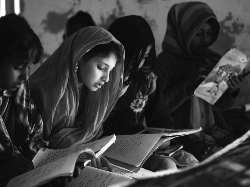 In rural Pakistan, remittances are associated with higher school enrolment, especially for girls. Photo: Bloomberg