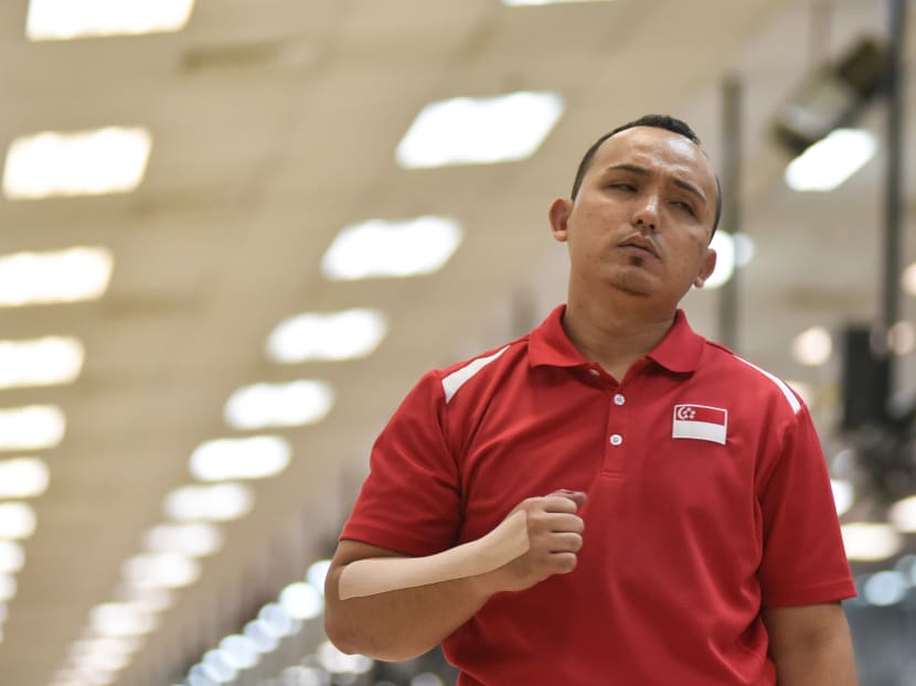 Mohamed Ismail pumping his fist in celebration while competing in the Mixed Singles TPB3 Para Bowling event on Tuesday. Photo: Sport Singapore