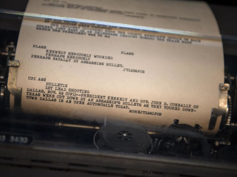 A page from the UPI newswire is displayed in a teletype reporting the assassination of United States President John F. Kennedy at the Newseum in Washington, DC, on Sept 26, 2013, 