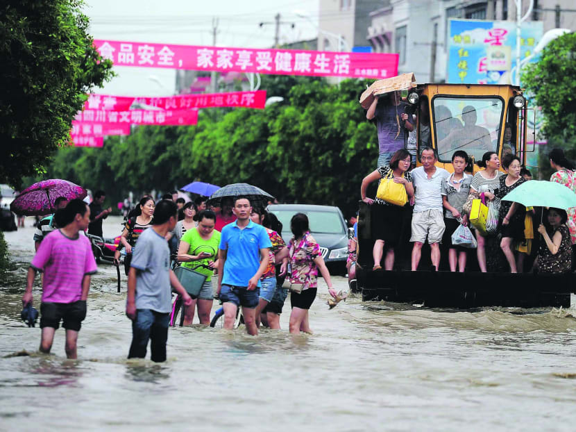 Gallery: Huge landslide in western China buries dozens