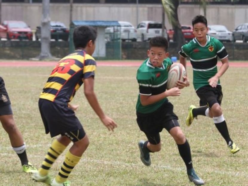 Anglo-Chinese School (ACS) Independent and Raffles Institution (RI) students. File photo: Singapore Rugby Union