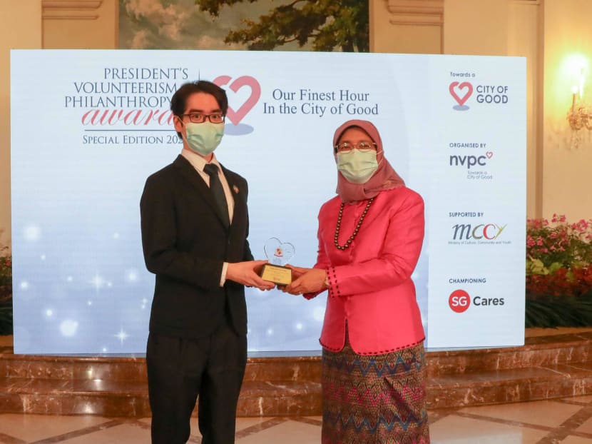 President Halimah Yacob (right) presenting the Leader of Good award to Mr Ainsley Ryan Lee during the President’s Volunteerism & Philanthropy Awards 2020 held at the Istana on Oct 16, 2020.
