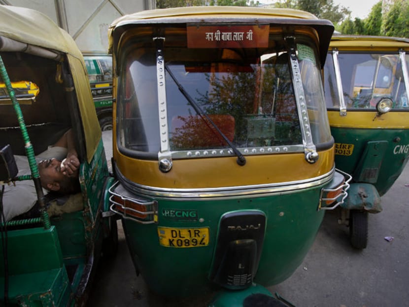 Auto rickshaws in New Delhi. The company is trying to improve the image of the vehicles and their drivers. Photo: The New York Times