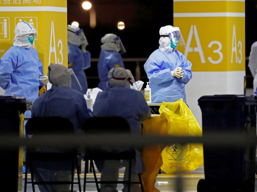 Health workers in protective suits waiting to conduct Covid-19 tests on staff at Pudong Airport in Shanghai, China on Nov 22, 2020. Health workers in protective suits waiting to conduct Covid-19 tests on staff at Pudong Airport in Shanghai, China on Nov 22, 2020.