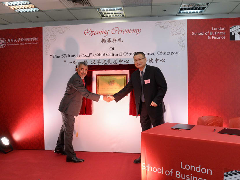 Mr Rathakrishnan Govind (left), London School of Business and Finance Global CEO, and Mr Zheng Tong Tao, dean of Xiamen University’s Overseas Education College, at the opening of the centre in Singapore yesterday. Photo: Robin Choo
