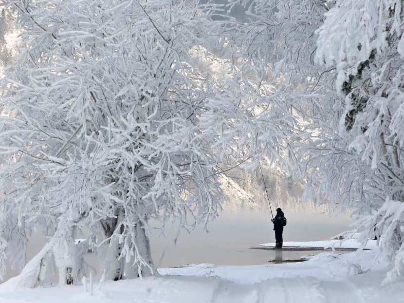 Photo of the day: A man fishes on a bank of the Yenisei River covered with snow and hoarfrost with the air temperature at about -16°C outside the Siberian city of Krasnoyarsk, Russia.