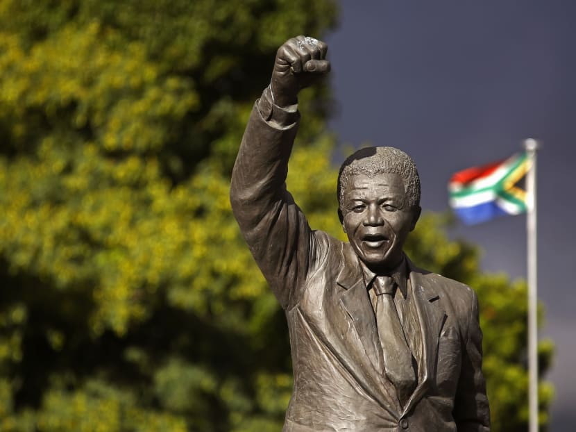 A statue of former South African President Nelson Mandela, with a raised fist, stands outside the former Victor Verster prison, renamed to Drakenstein Correctional center, near the town of Franschhoek, South Africa. Photo: AP