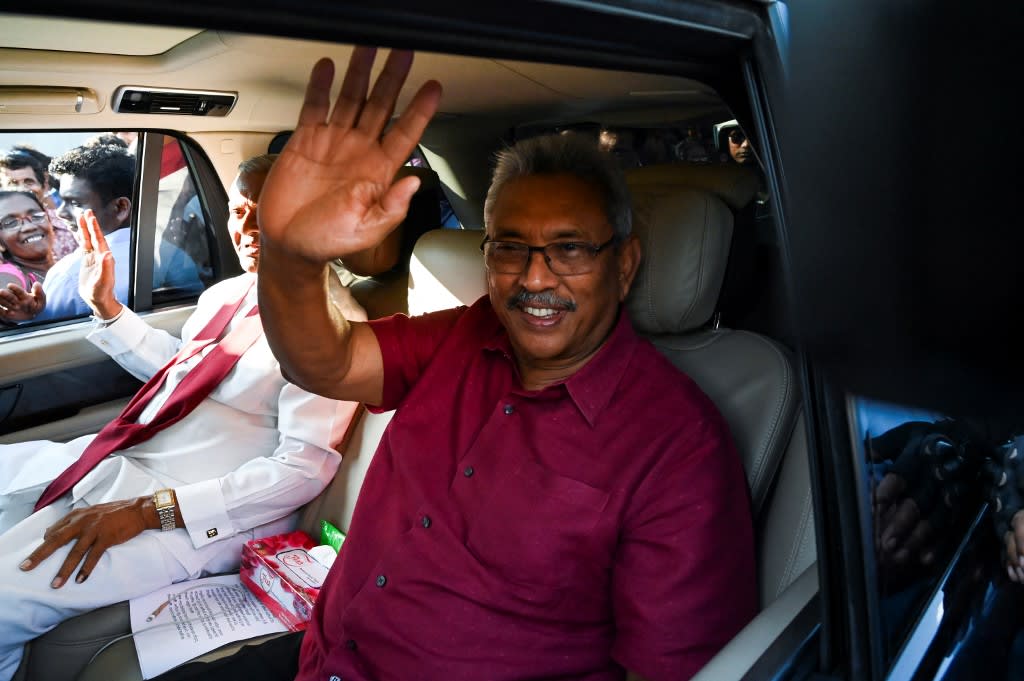 In this file photo taken on Nov 17, 2019, Sri Lanka's then-president-elect Gotabaya Rajapaksa waves to supporters as he leaves the election commission office in Colombo.&nbsp;