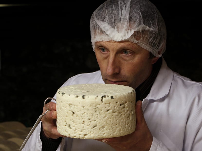 Researchers at Purdue University announced findings that show people have a distinct and basic taste for fat. In this Jan 21, 2009 file photo, Bernard Roques checks a Roquefort cheese as it matures. Photo: AP