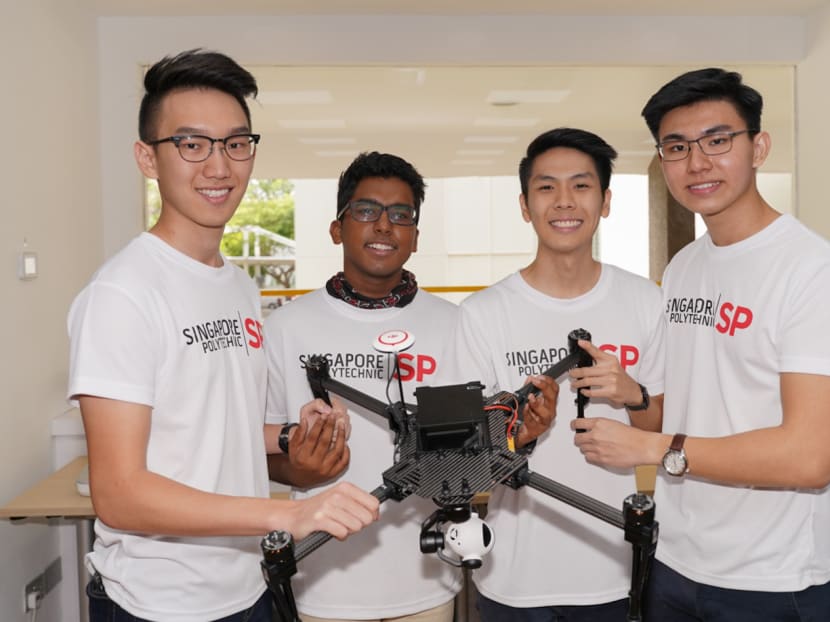 (Left to right) Singapore Polytechnic students Chung Zhuo Han, Arjun Vijay, Brandon Tan Min Ren and Lee Jun Hao with one of their 'SP Secure' drones.