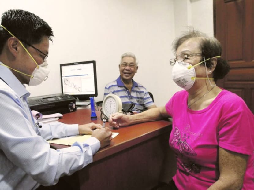A file picture of a patient consulting a general practitioner during the haze period in Singapore. Doctors advise people who are most vulnerable to respiratory problems, such as seniors and young children, to take precautions. A file picture of a patient consulting a general practitioner during the haze period in Singapore. Doctors advise people who are most vulnerable to respiratory problems, such as seniors and young children, to take precautions.