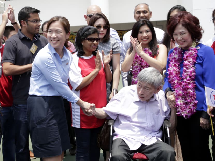 WP candidate He Ting Ru (left) greeting former Potong Pasir MP Chiam See Tong at Kong Hwa Primary School nomination centre yesterday. Photo: Wee Teck Hian