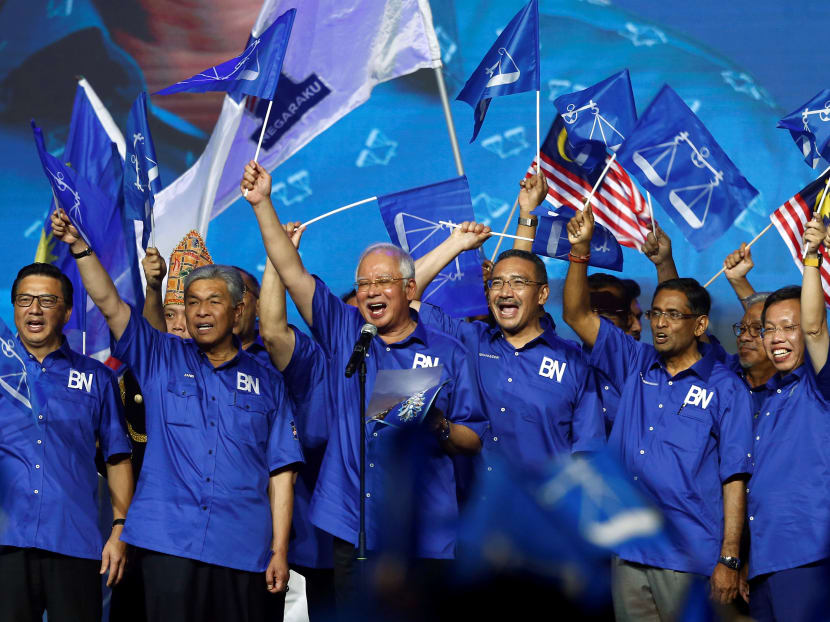 Malaysia's Prime Minister Najib Razak and other party leaders wave the ruling BN flags during the launch of its election manifesto. Malaysia’s Election Commission (EC) is likely to announce nomination and polling dates for the country’s general election on Tuesday.