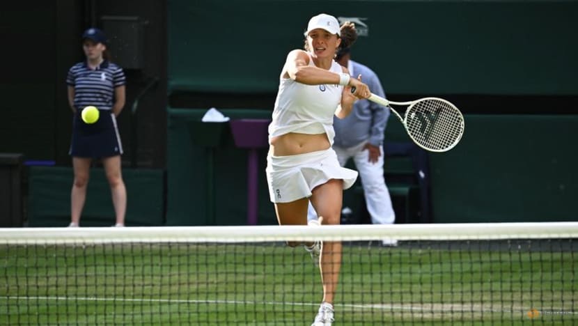 Top seed Swiatek fights back from the brink to beat Bencic