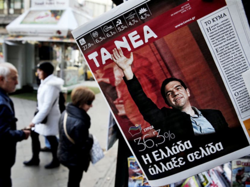 A kiosk in Athens displaying a newspaper featuring Mr Alexis Tsipras, the leader of Greece’s Syriza left-wing main opposition party that won Sunday’s national elections. Photo: AP