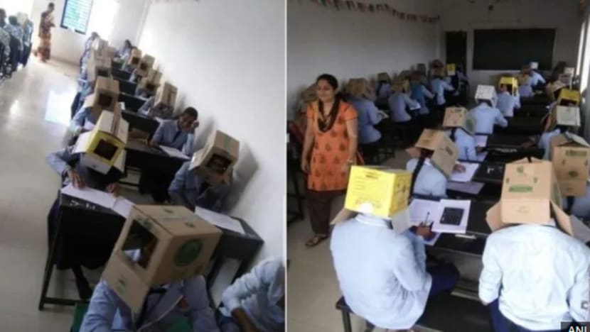 Pelajar warga India pakai kotak kadbod di kepala semasa peperiksaan